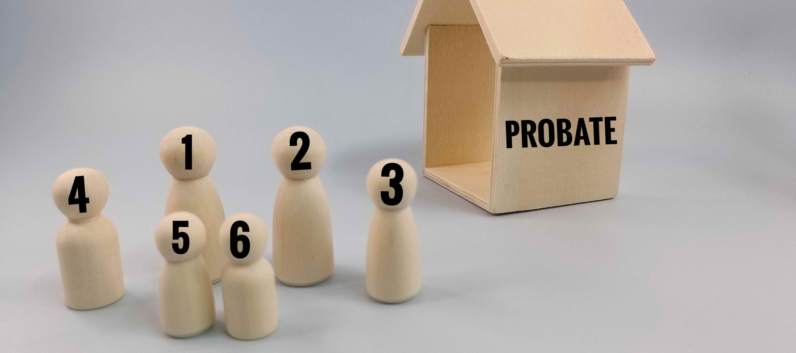 number of wood model people and a house